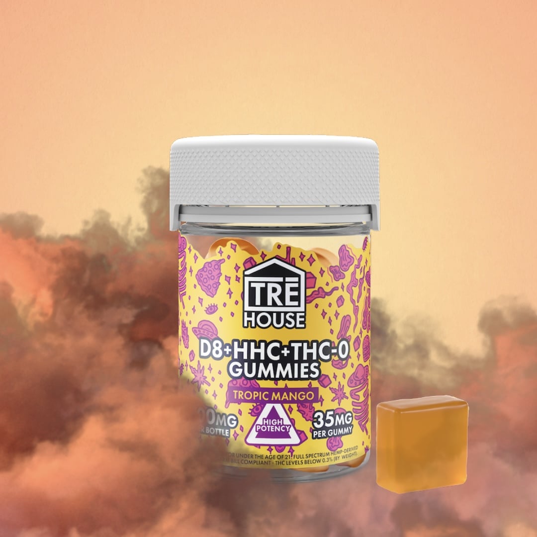Trehouse tropical mango thc blend gummies on orange fiery background with orange and red smoke all around it.