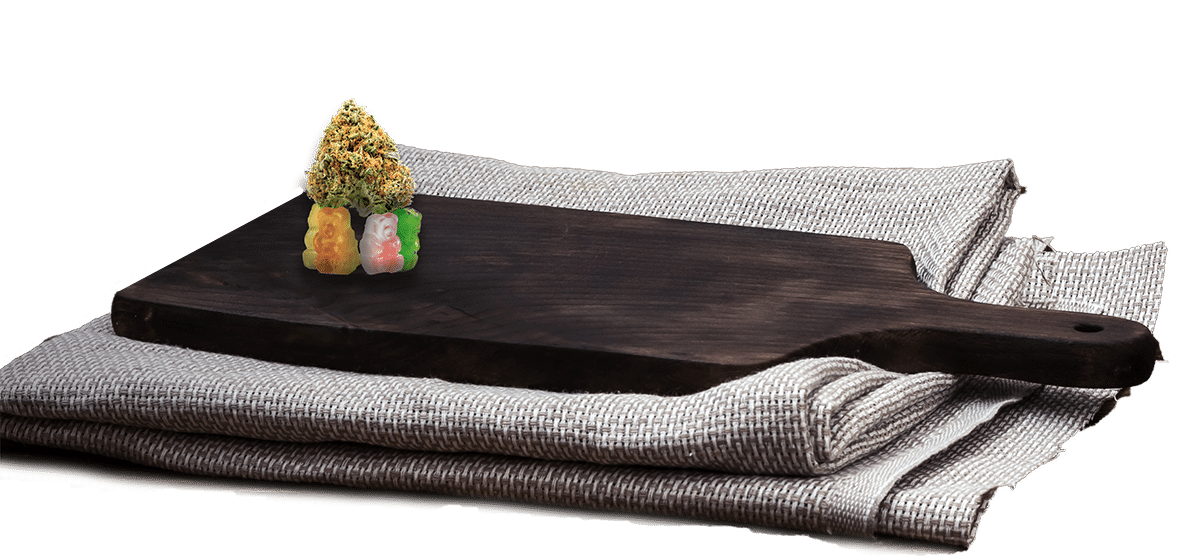 Five thc gummy bears cannabis bud wooden cutting boarrd