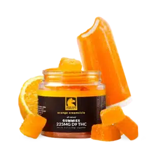 A open jar of trojan horse delta 9 THC gummies with an orange creamsicle popsicle and a orange slice in background.