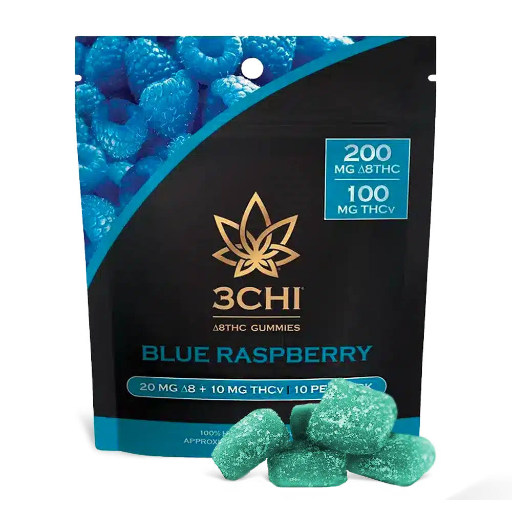 The product packaging of a 3Chi Blue Raspberry THCV Gummies 10-pack with several life-size examples of the blue and teal gummies on display in front of the package.